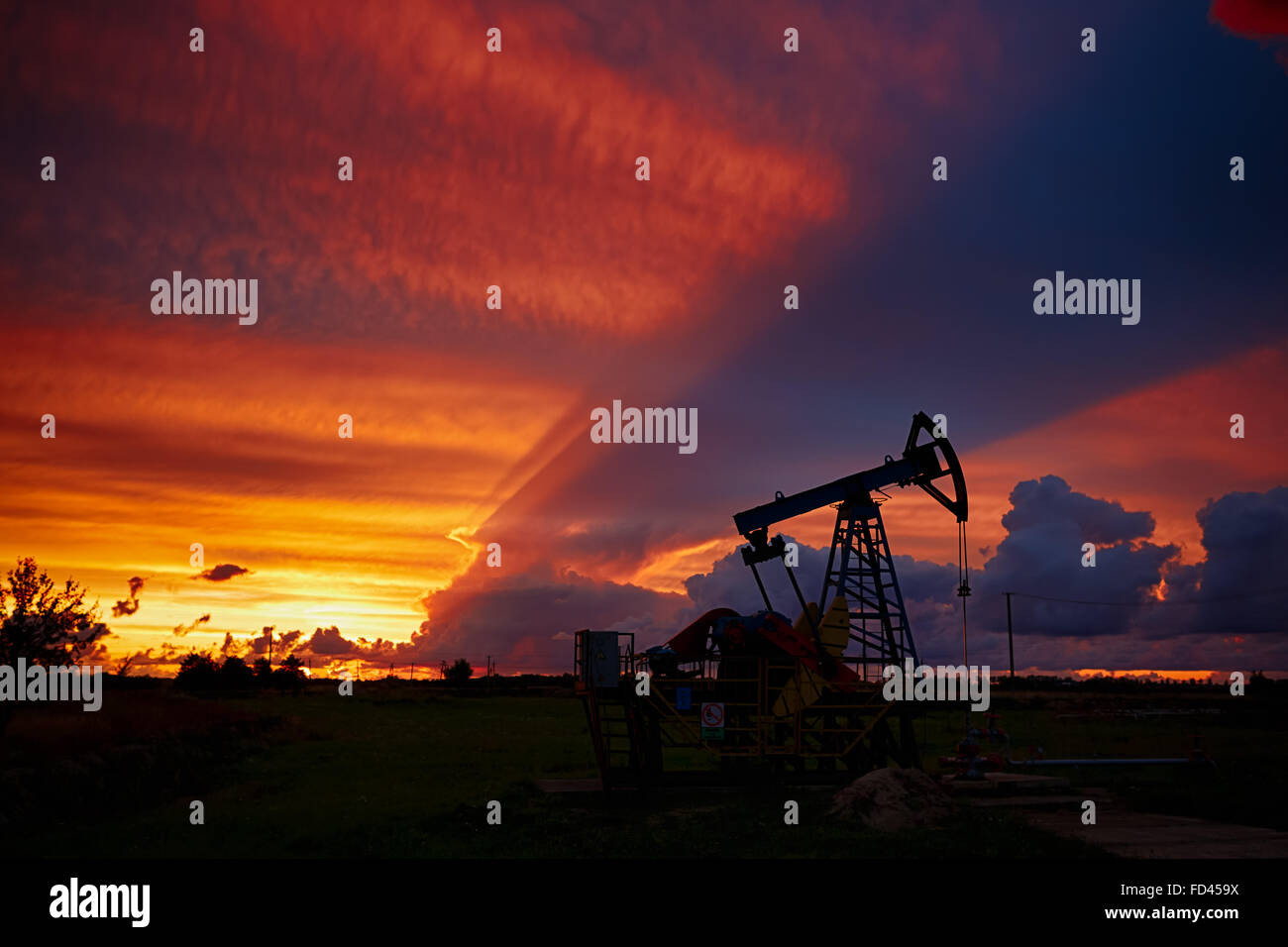 Oil derricks on a background of beautiful sunset, Kaliningrad, Russia Stock Photo