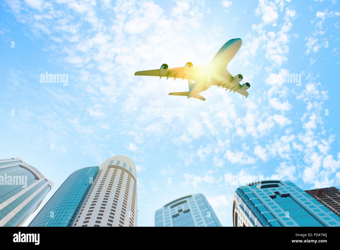 Image of airplane flying above skyscrapers. Bottom view Stock Photo - Alamy