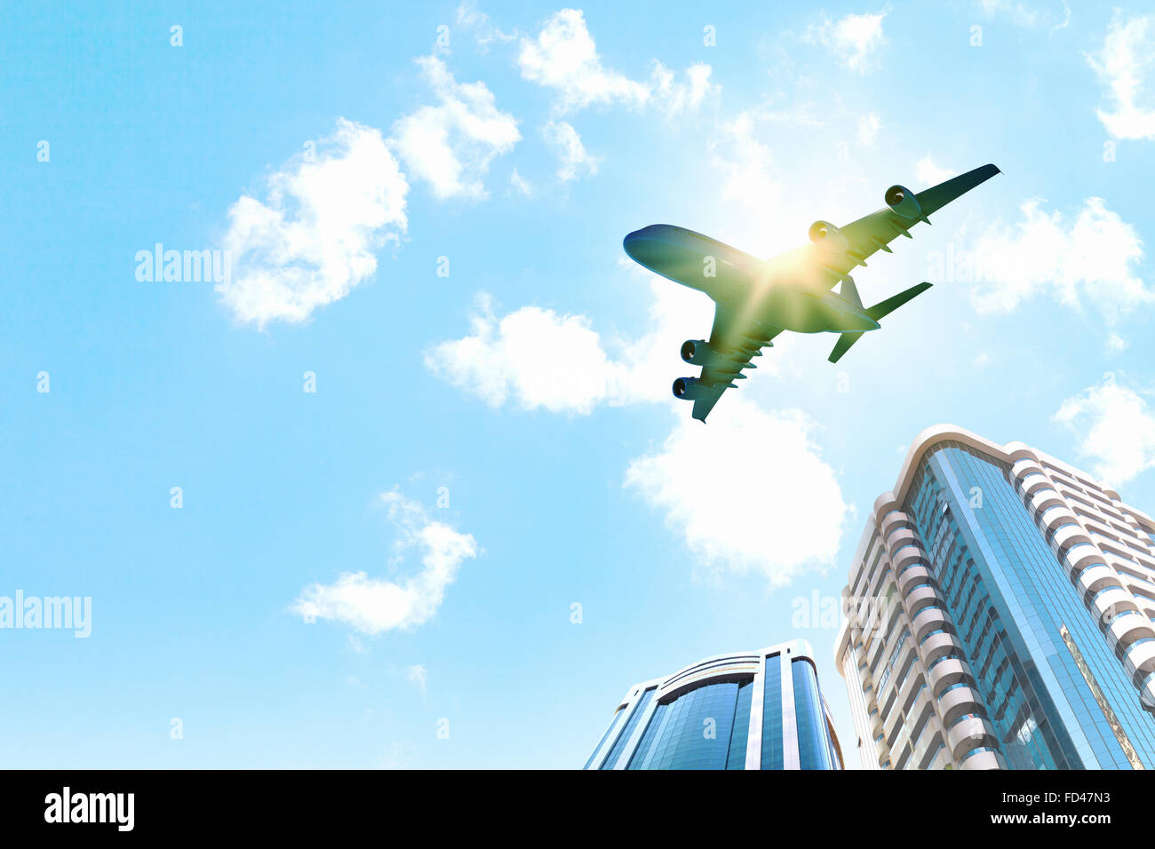 Image of airplane flying above skyscrapers. Bottom view Stock Photo - Alamy