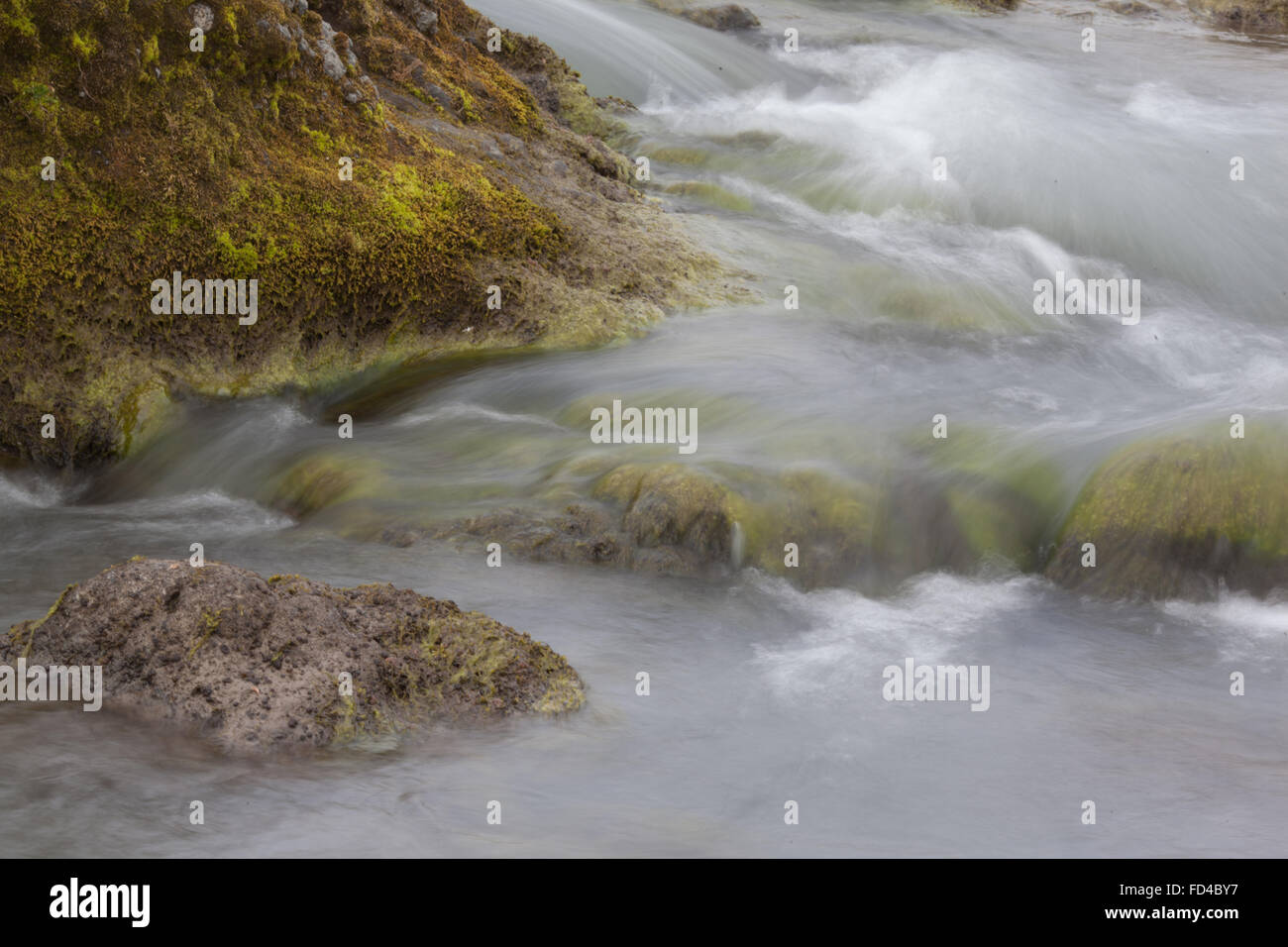 Scenic View Of River Flowing Through Rocks Stock Photo - Alamy