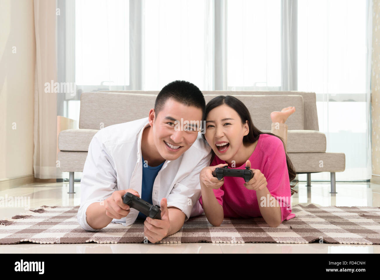 Couple Playing Video Game - Stock Photo - Masterfile - Premium