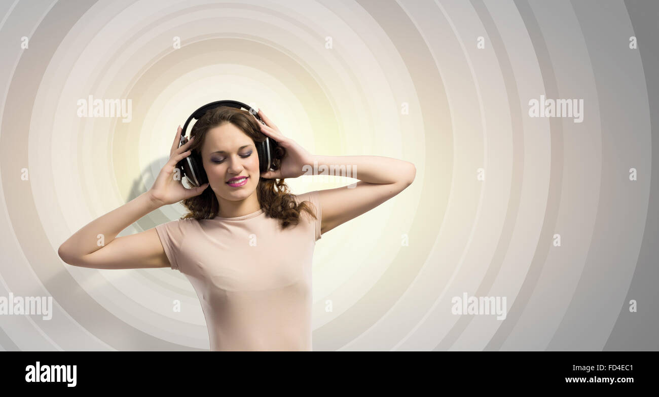 Young girl wearing headphones and listening to music Stock Photo - Alamy