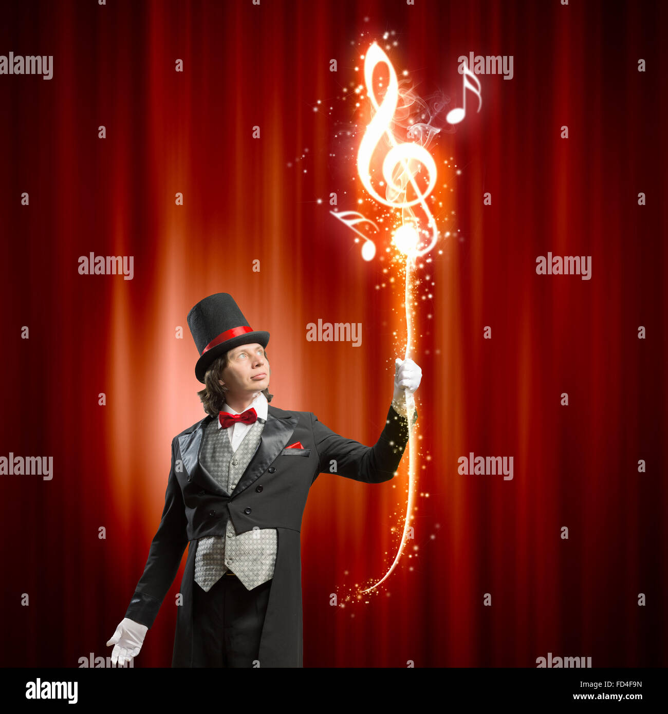 Image of man magician showing trick against color background Stock ...