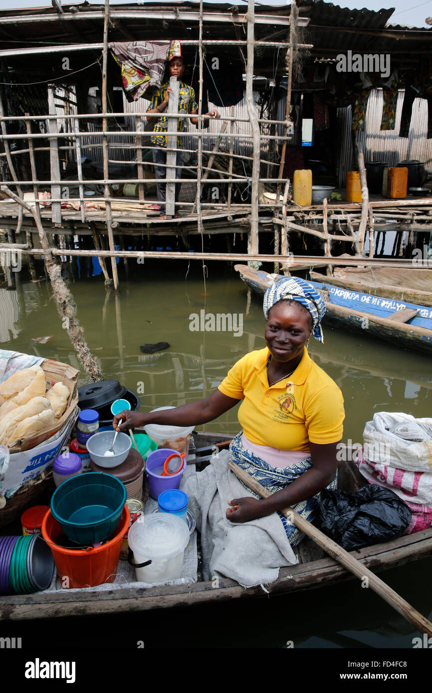 Vivianne Degbo runs a floating cafeteria financed by a loan of 100,000F CFA from Alide microfinance institution Stock Photo
