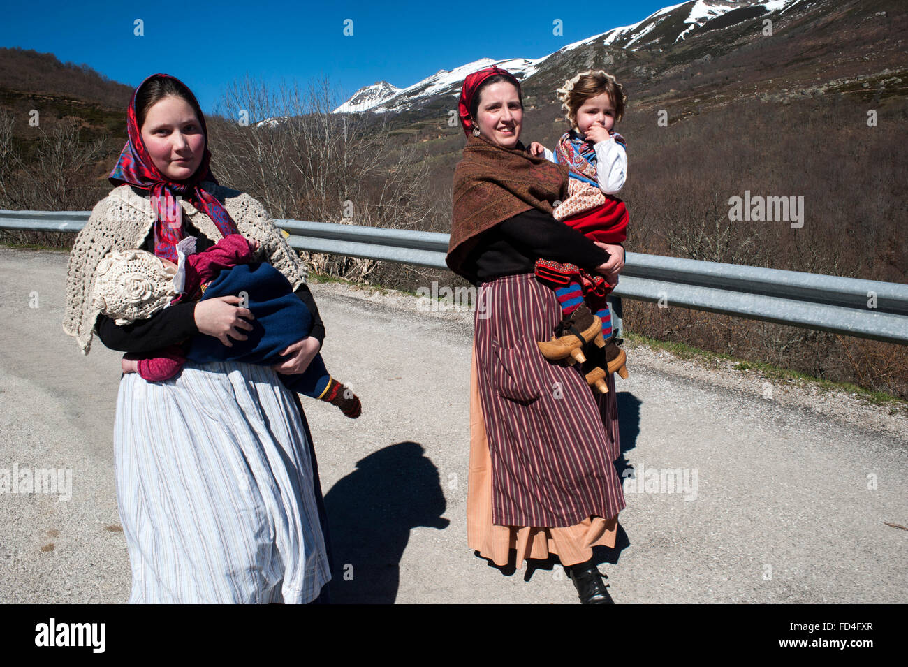 Two young couples with their children participating in the carnival zamarrones Polaciones with typical costumes of the valley Stock Photo