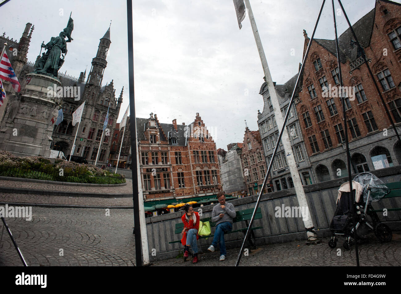 Several buildings in the market square (Markt) Bruges are reflected in glass. Stock Photo