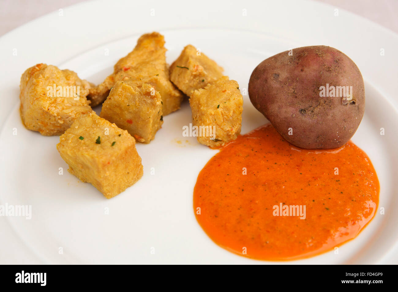 Carne Fiesta, papas arrugadas and mojo rojo served in Tenerife, Spain. The foods are all traditional Canarian dishes. Stock Photo