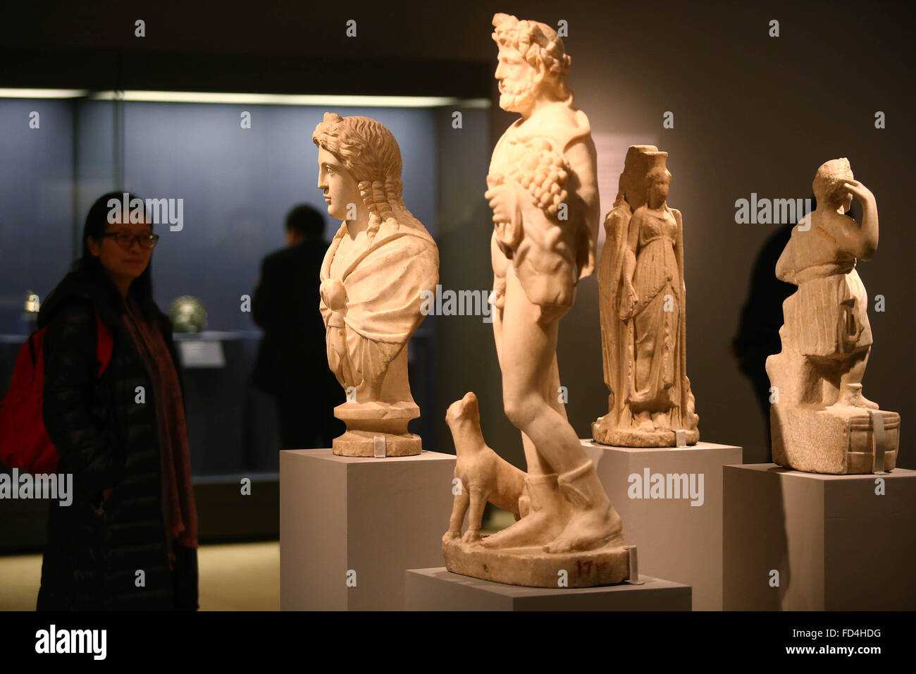 (160128) -- BEIJING, Jan. 28, 2016 (Xinhua) -- People visit the exhibition 'Treasures of Romania' at National Museum of China in Beijing, capital of China, on Jan. 28, 2016. The three-month exhibition opened here Thursday, showcasing Romania's history from the pre-historical period to the end of the 18th century with 445 pieces (sets) of exhibits. (Xinhua/Lu Xu) (yjc) Stock Photo