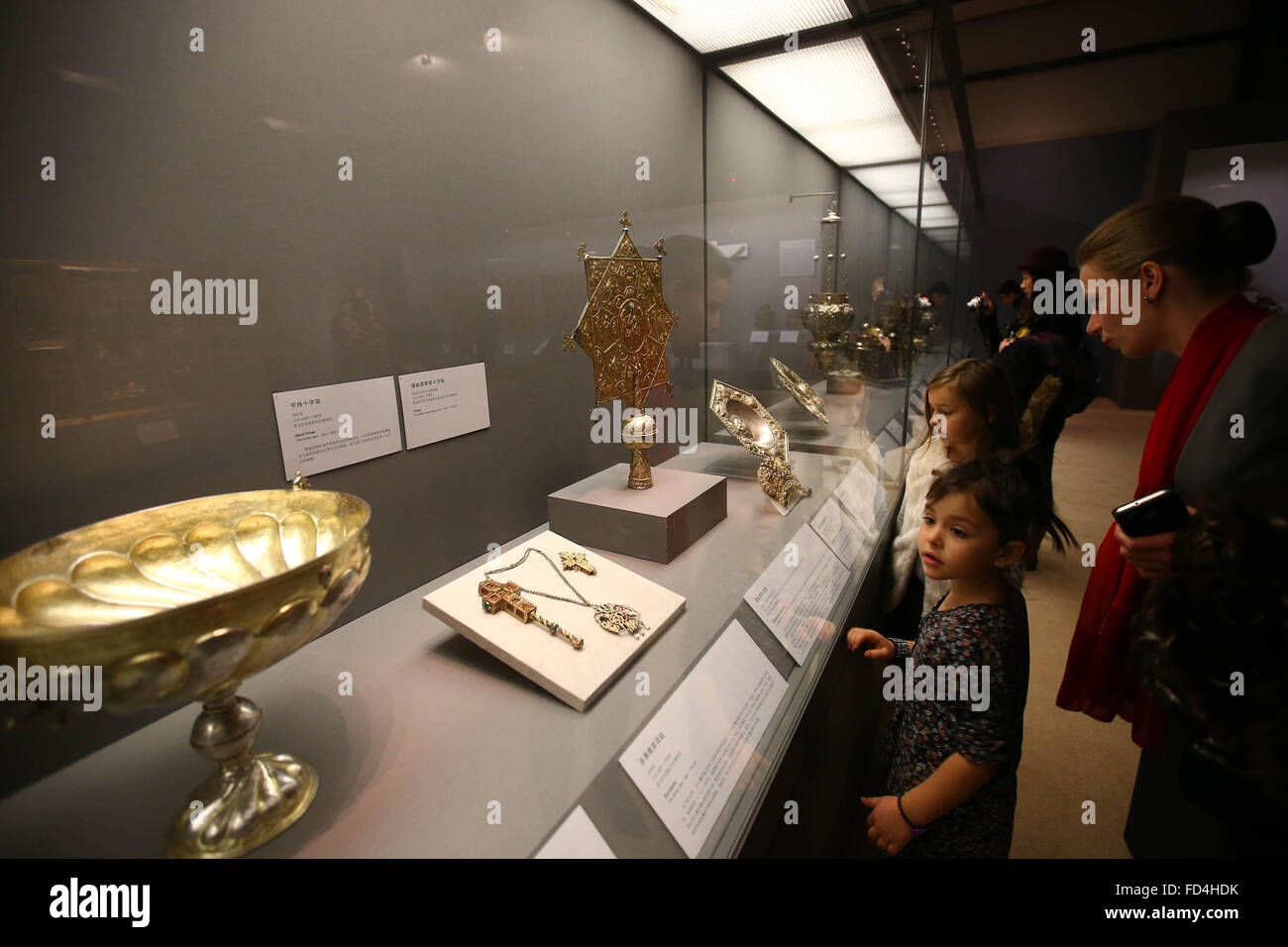 (160128) -- BEIJING, Jan. 28, 2016 (Xinhua) -- People visit the exhibition 'Treasures of Romania' at National Museum of China in Beijing, capital of China, on Jan. 28, 2016. The three-month exhibition opened here Thursday, showcasing Romania's history from the pre-historical period to the end of the 18th century with 445 pieces (sets) of exhibits. (Xinhua/Lu Xu) (yjc) Stock Photo