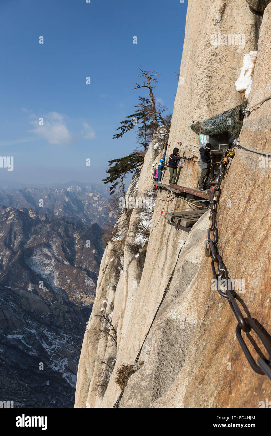 Climbers walking on the Danger Trail of Mount Hua Shan Stock Photo