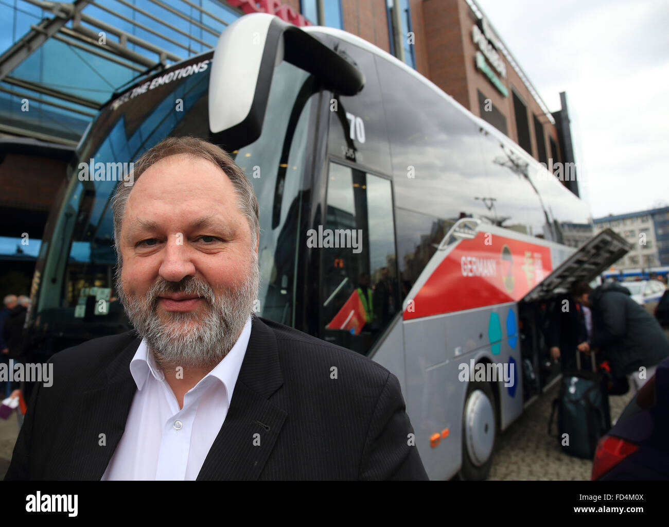 Andreas Michelmann, president of the German Handball Association (DHB Deutscher Handballbund), is seen next to the team bus in Wroclaw, on his way to the next venue in Krakow during the EHF European Men's Handball Championship 2016 in Poland, 28 January 2016. Photo: Jens Wolf/dpa Stock Photo