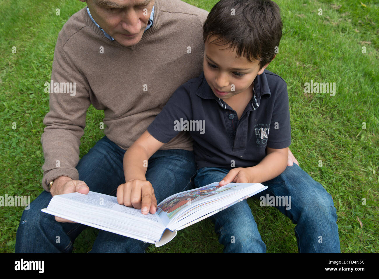 Father and son reading a children