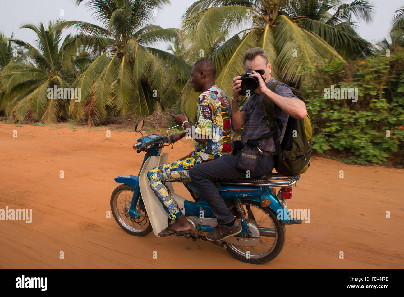 Photographer on a motorcycle taxi Stock Photo - Alamy