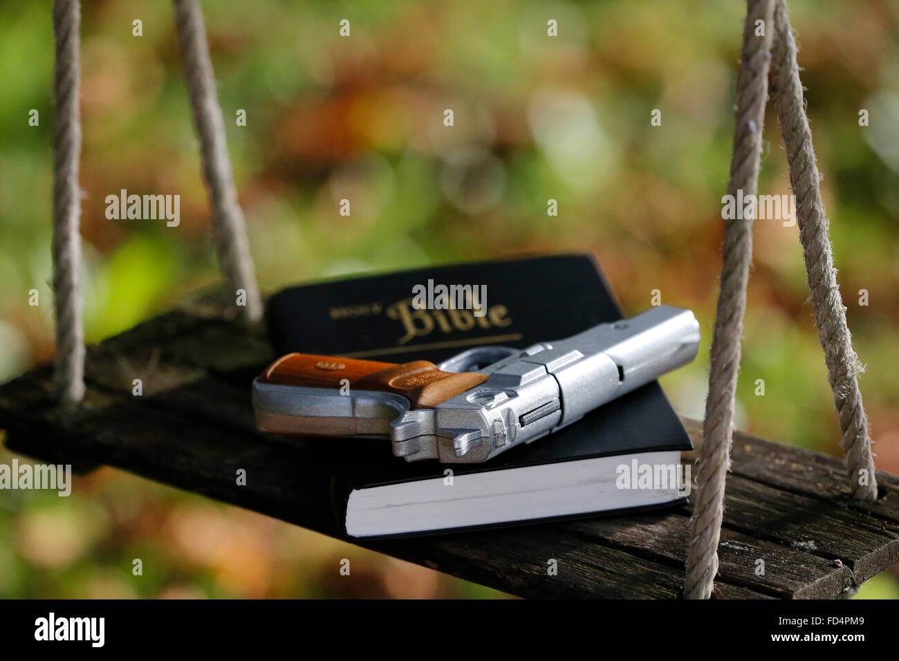 Holy Bible and gun Stock Photo Alamy