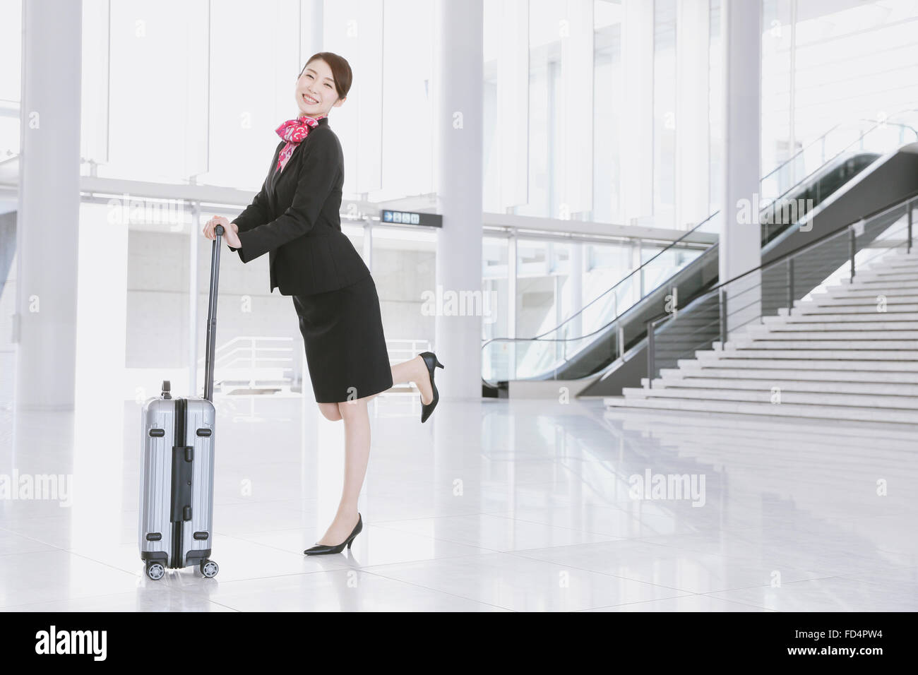 Japanese attractive flight attendant at the airport Stock Photo - Alamy