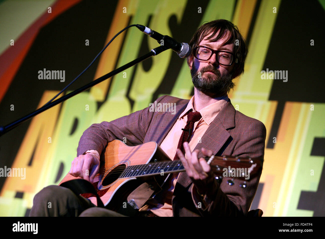 Jarvis Cocker sings one of his Pulp songs to demonstrate a point during his keynote speech at the Midland Hotel. Stock Photo