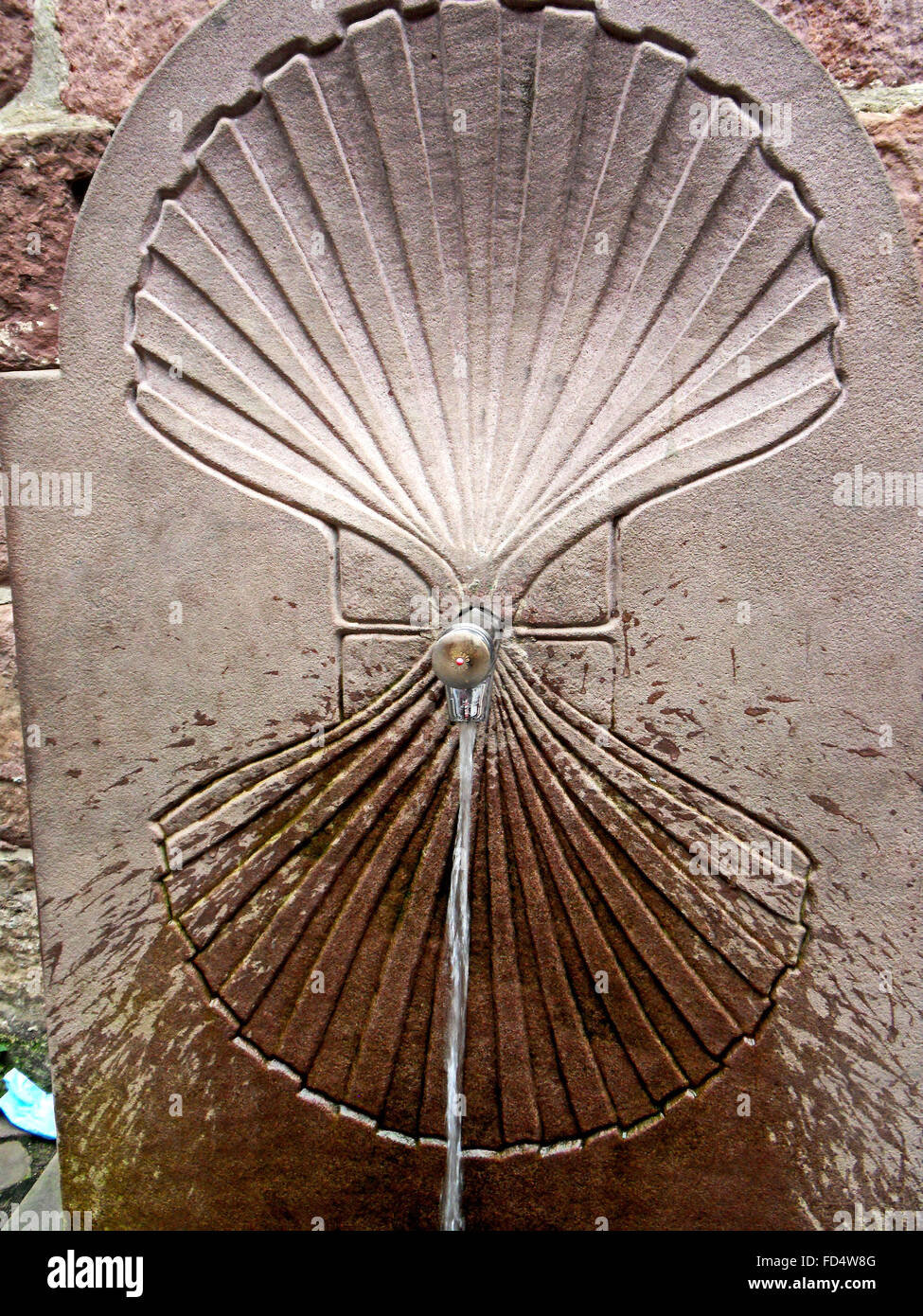 Water fountain with a scallop motif. Stock Photo