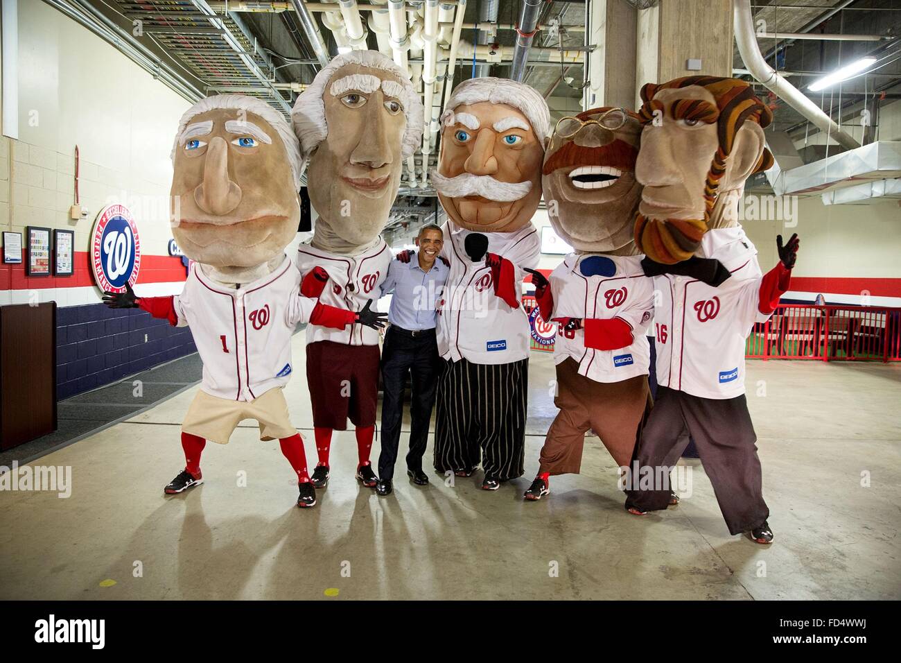 U.S. President Barack Obama poses with the Racing Presidents, mascots for the Washington Nationals baseball team at Nationals Park June 11, 2015 in Washington, DC. Stock Photo