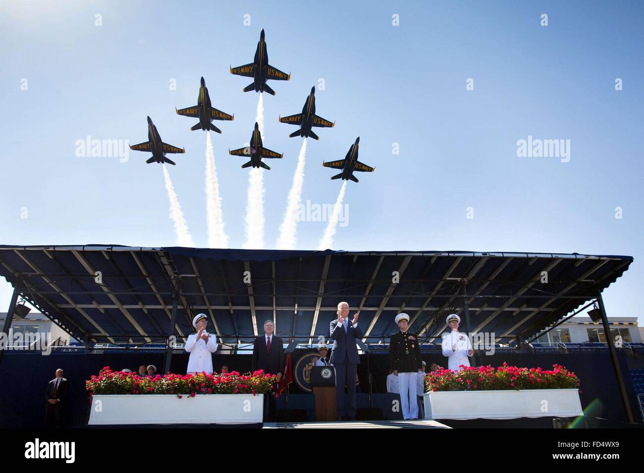 The Navy Blue Angels flyover as the Vice President Joe Biden and other officials applauded during the commencement ceremonies at the Naval Academy May 22, 2015 in Annapolis, Maryland. Stock Photo