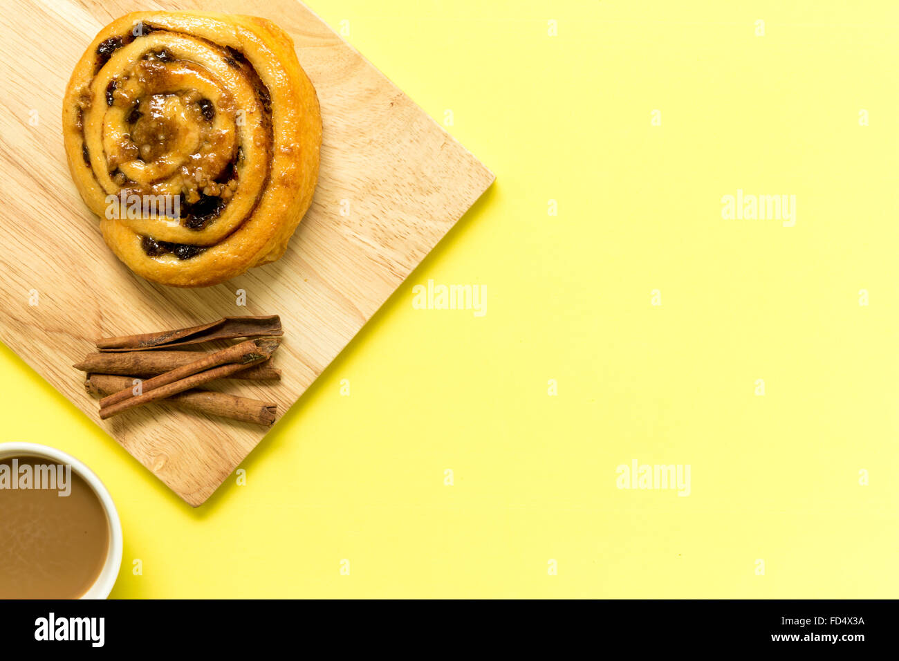 Cinnamon roll freshly made to eat with coffee for break. Stock Photo