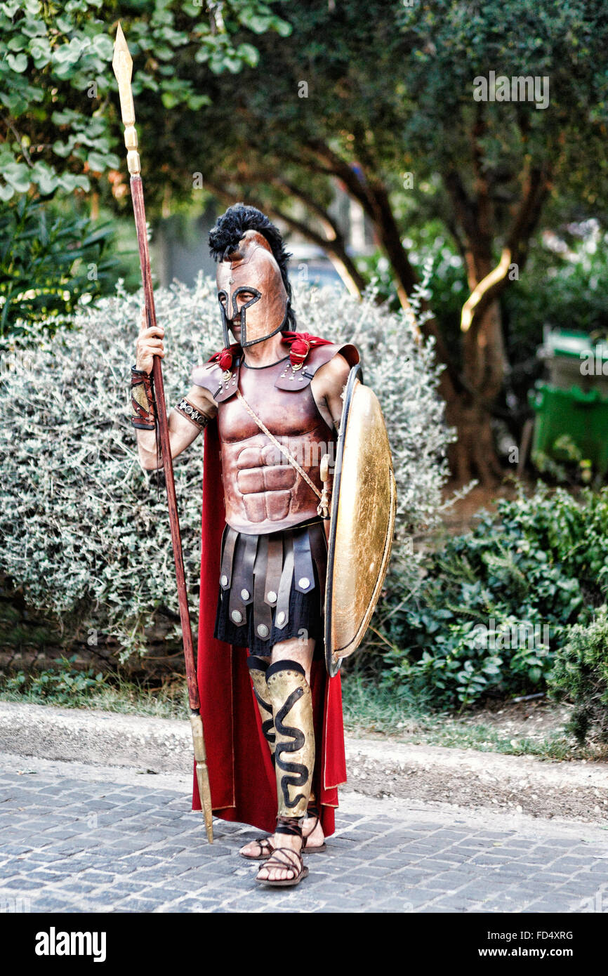 A man in costume of an ancient Greek warrior in the streets of Athens, Greece Stock Photo