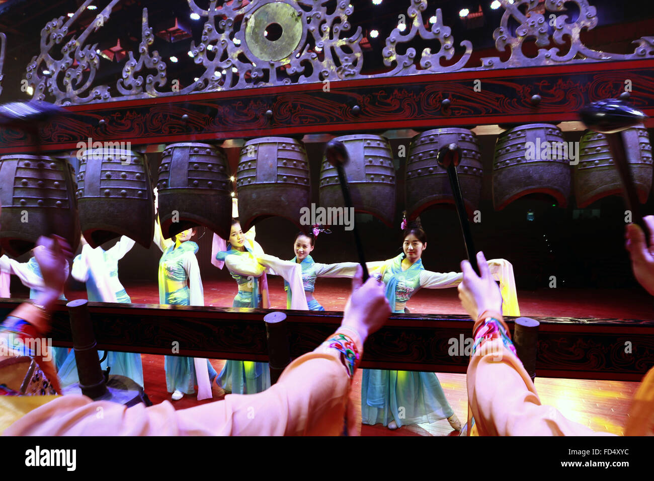 Jiangsu, China. 28th January, 2016. Artists dance to the music played ...