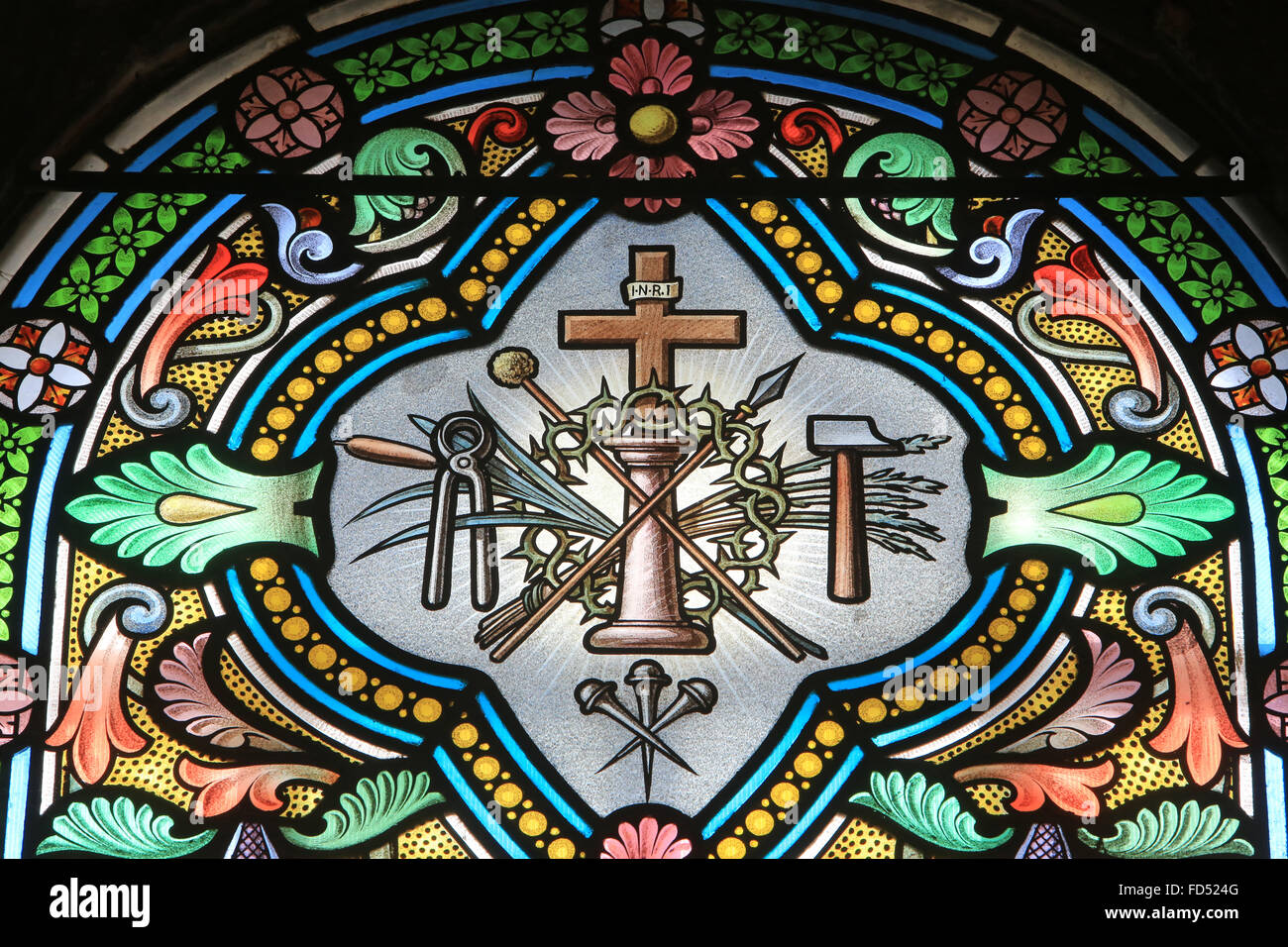 Weapons of Christ. Instruments. The Passion of Christ. Stained glass window. Shrine of Our Lady of la Salette. Stock Photo