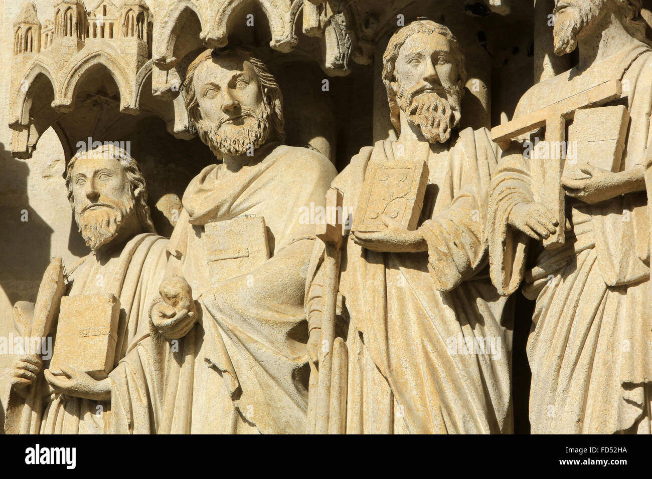 Statues in the splay and the left sidewall of the central portal: from right to left, the apostles : Thomas the Apostle, St. Mat Stock Photo
