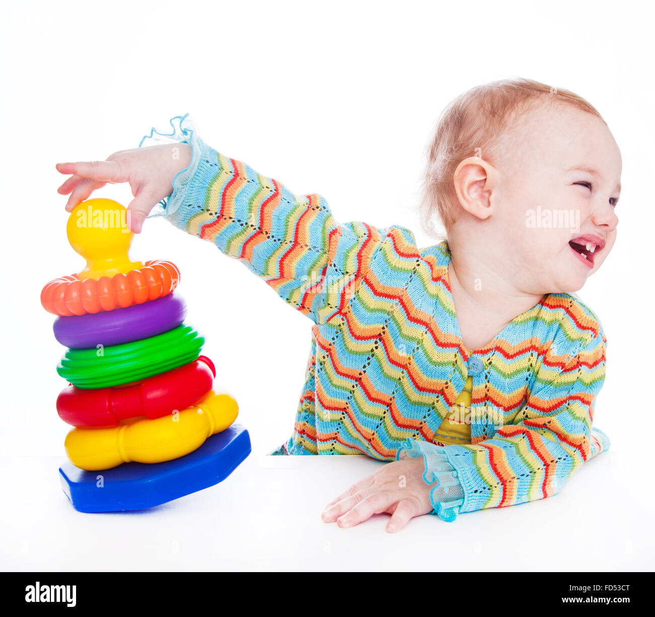 Child building a colorful pyramid Stock Photo - Alamy