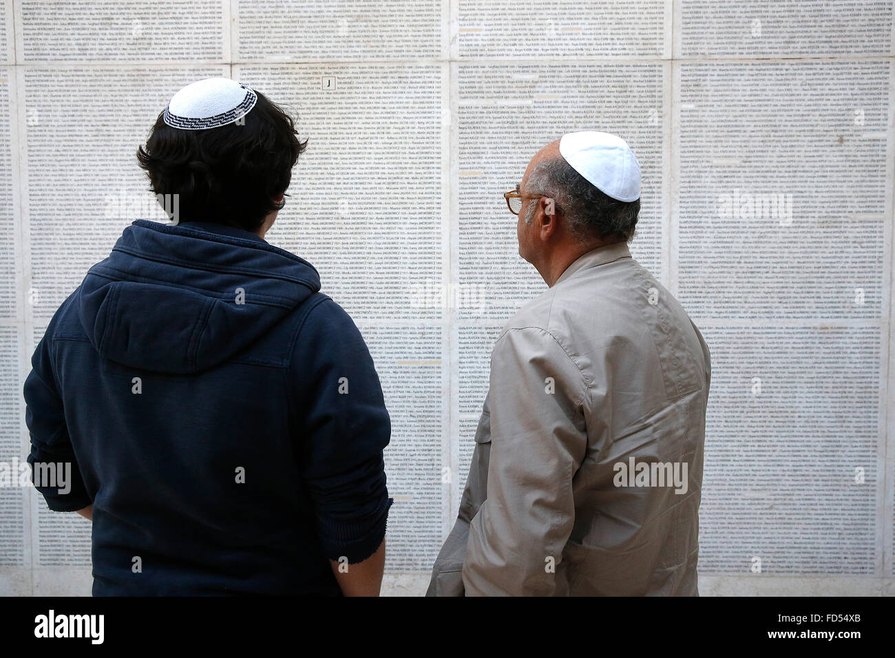 Wall of names at the Paris Holocaust memorial. Father and son Stock