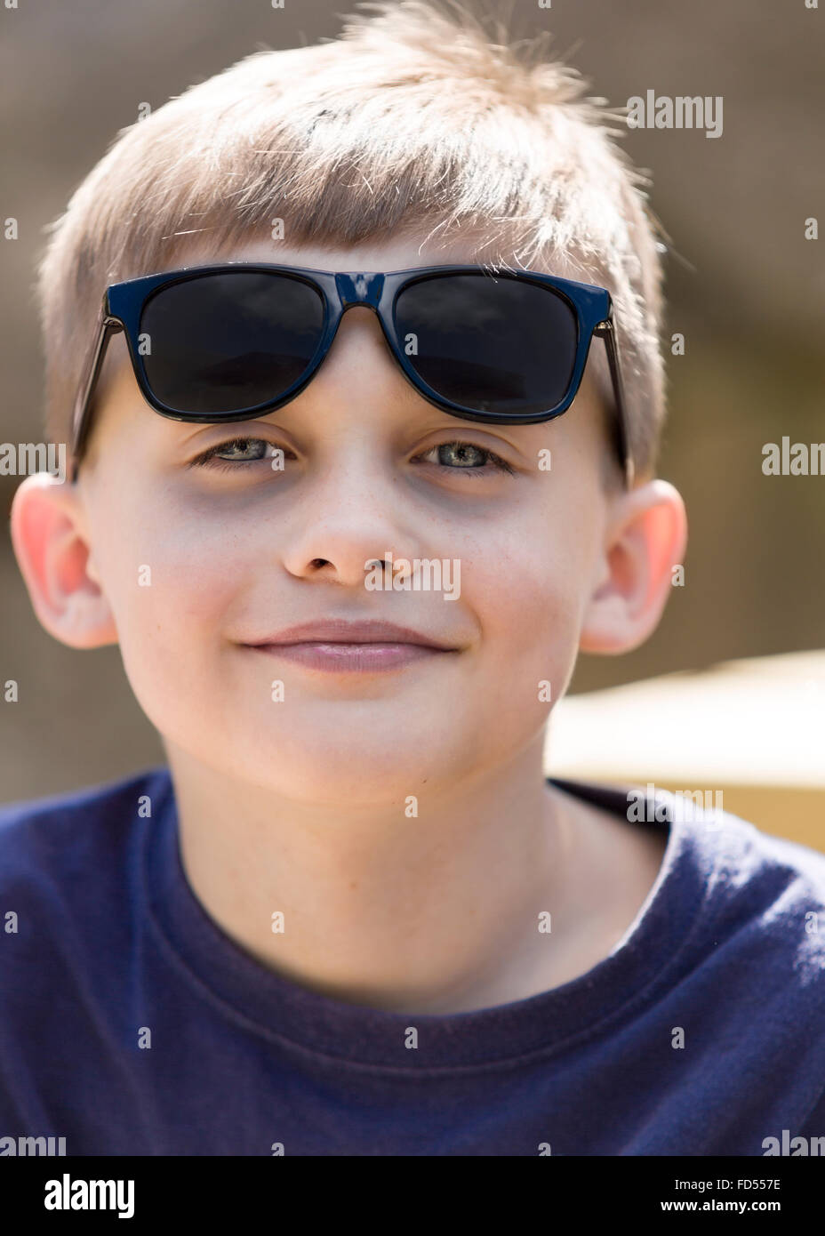 Young boy wearing sunglasses outdoor portrait  Model Release: Yes.  Property Release: No. Stock Photo