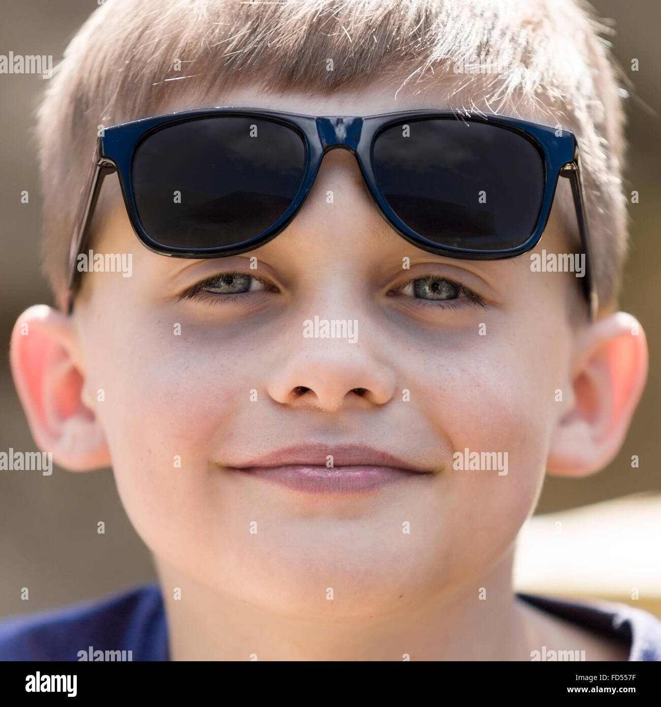 Young boy wearing sunglasses outdoor portrait  Model Release: Yes.  Property Release: No. Stock Photo