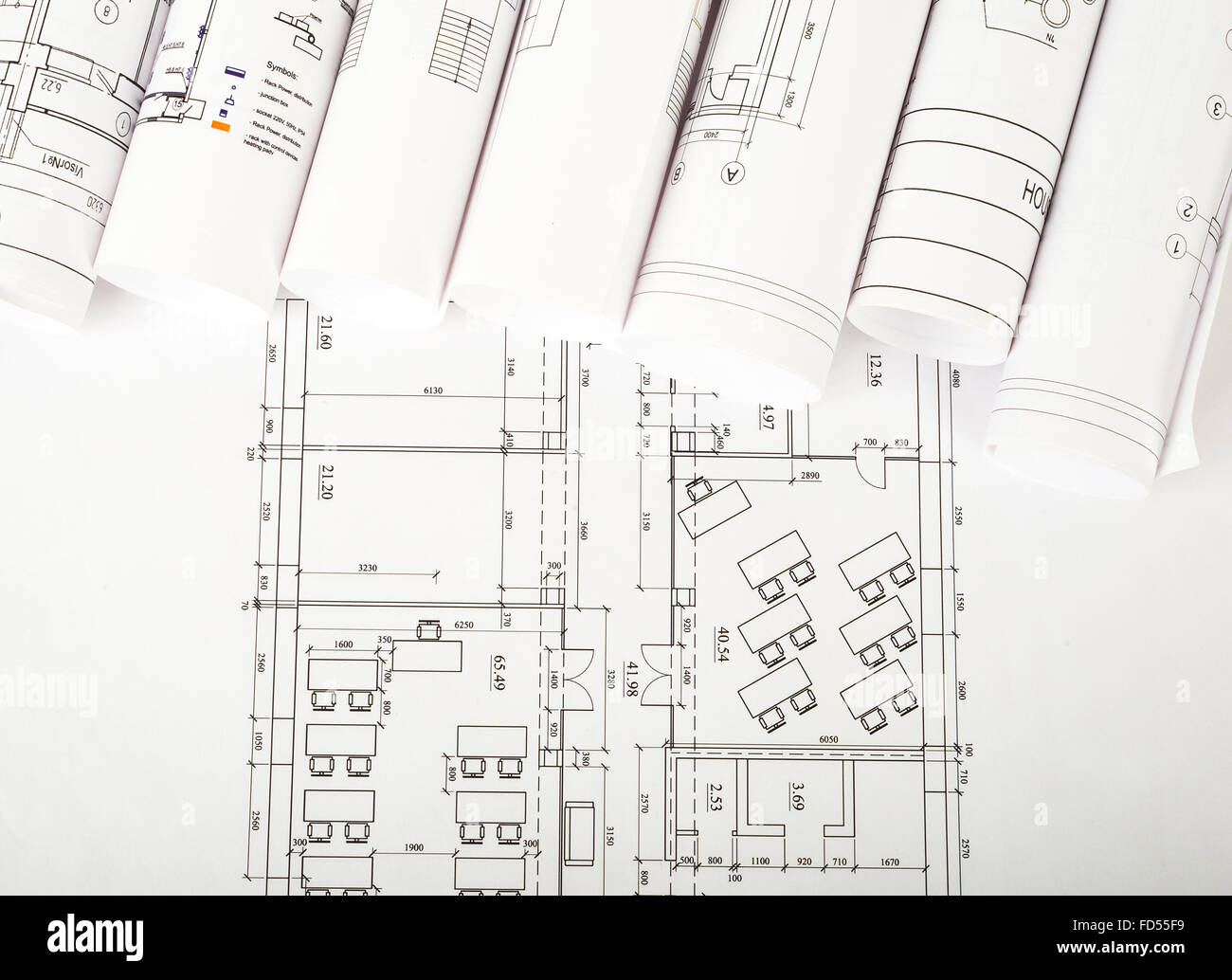 Architectural blueprint rolls on white Stock Photo - Alamy