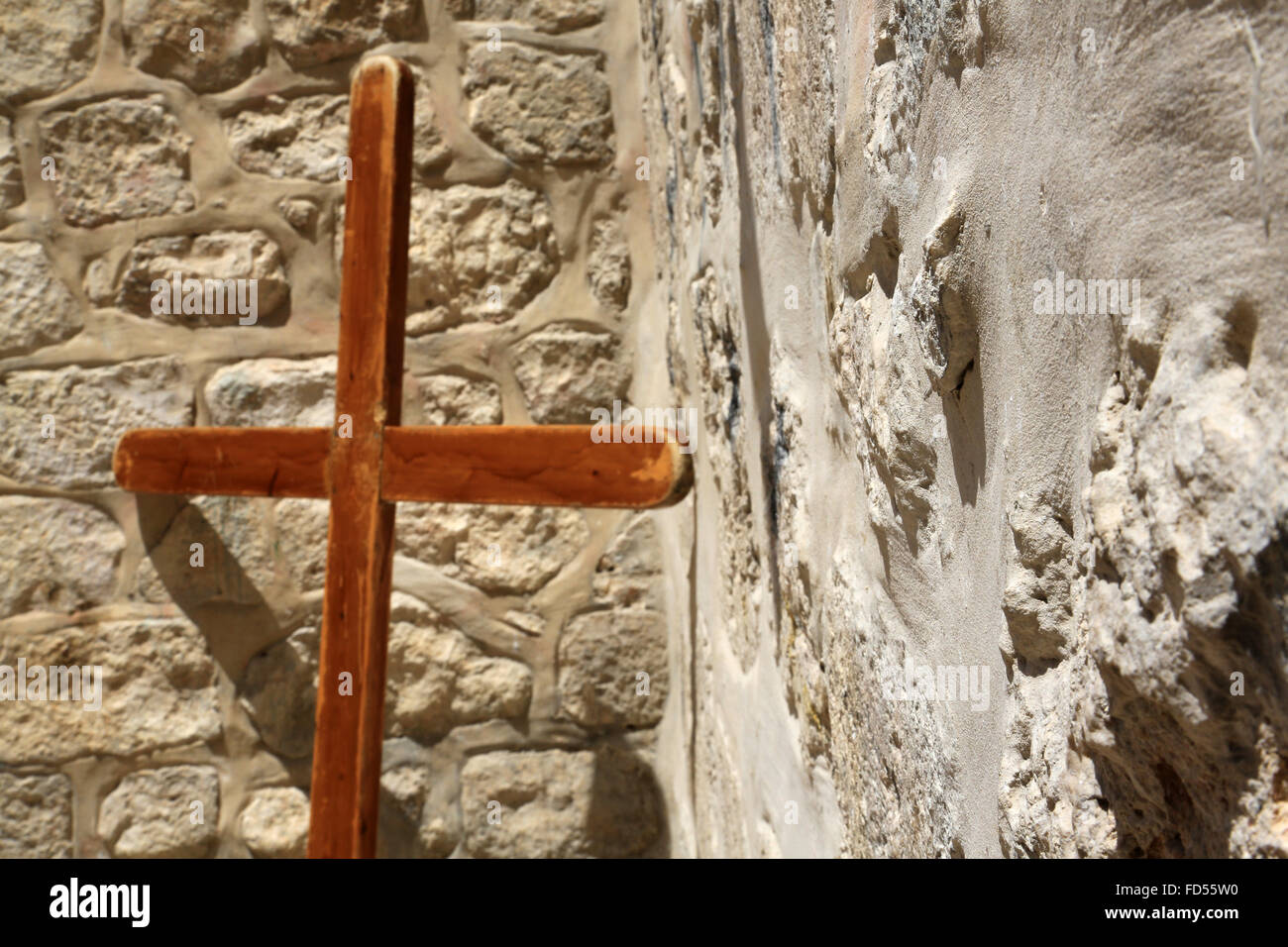 Cross on a wall. Stock Photo