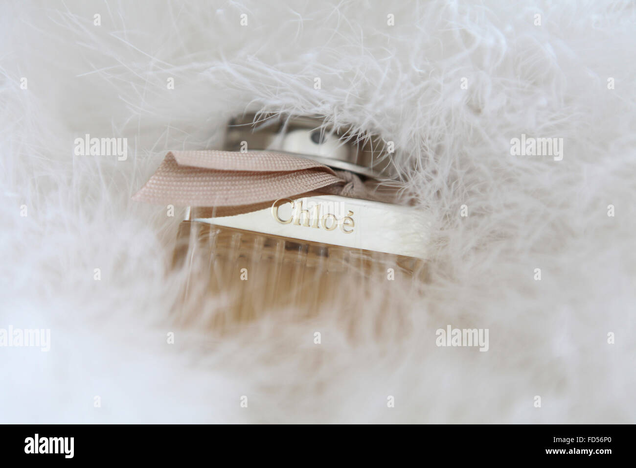 Chloe perfume on white feathers Stock Photo