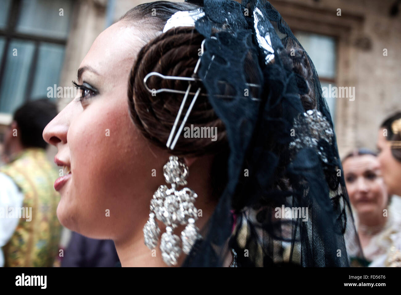 A girl with typical impellers hair ornament in the falleras Stock Photo