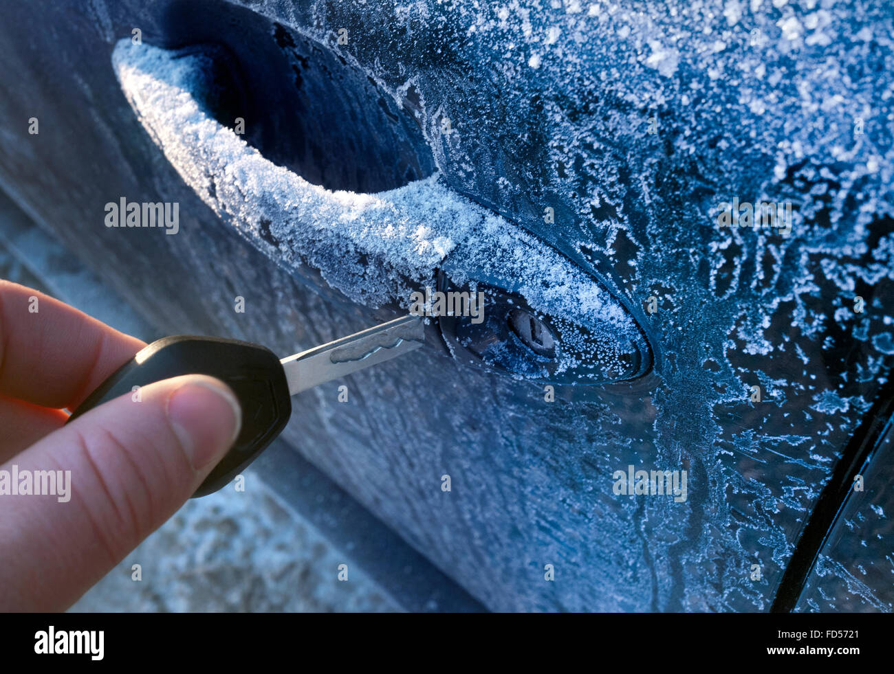 Unlocking A Car Door On A Cold Frozen Winter Morning Stock