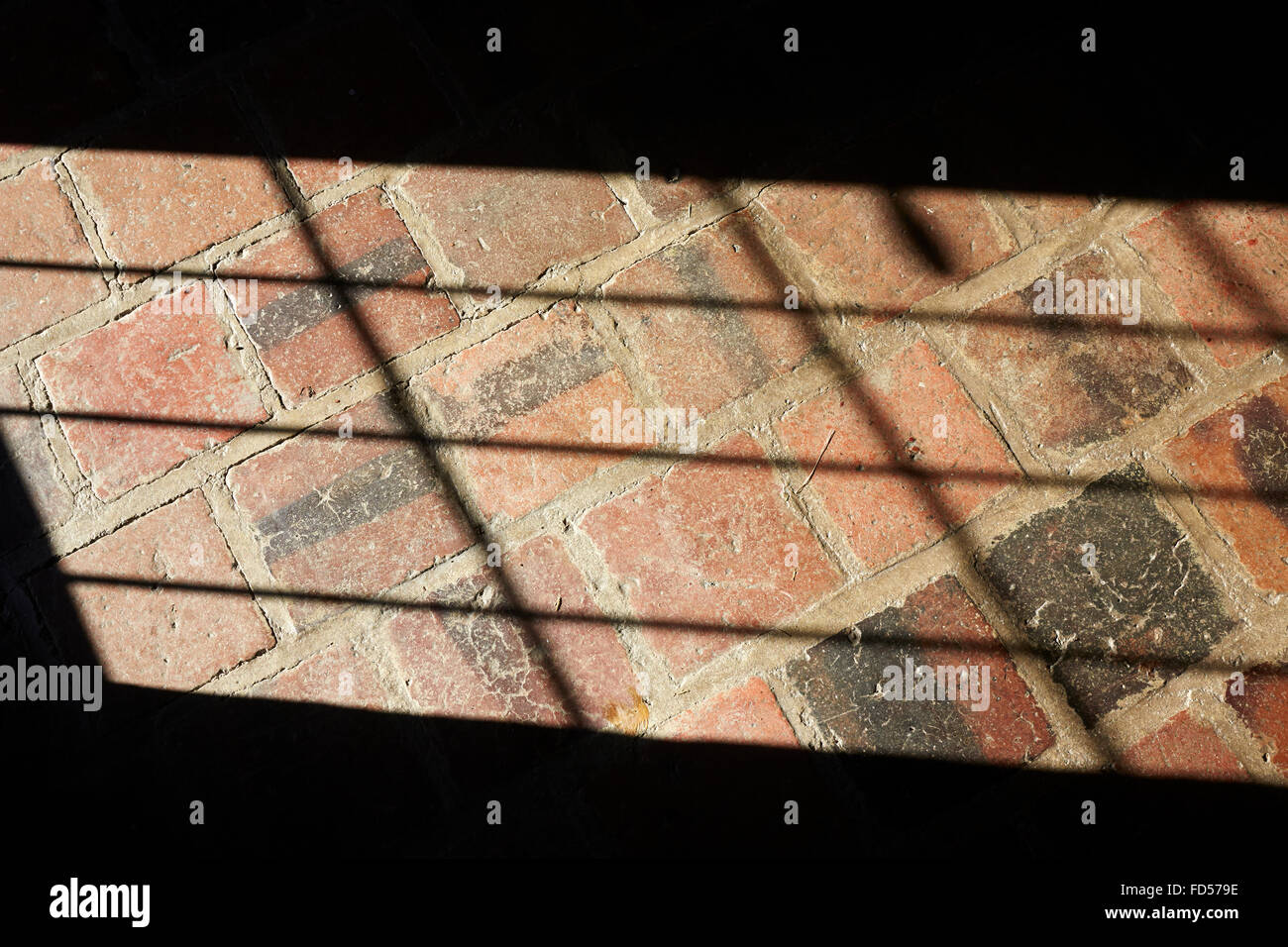 Light pattern on a tile floor. Stock Photo
