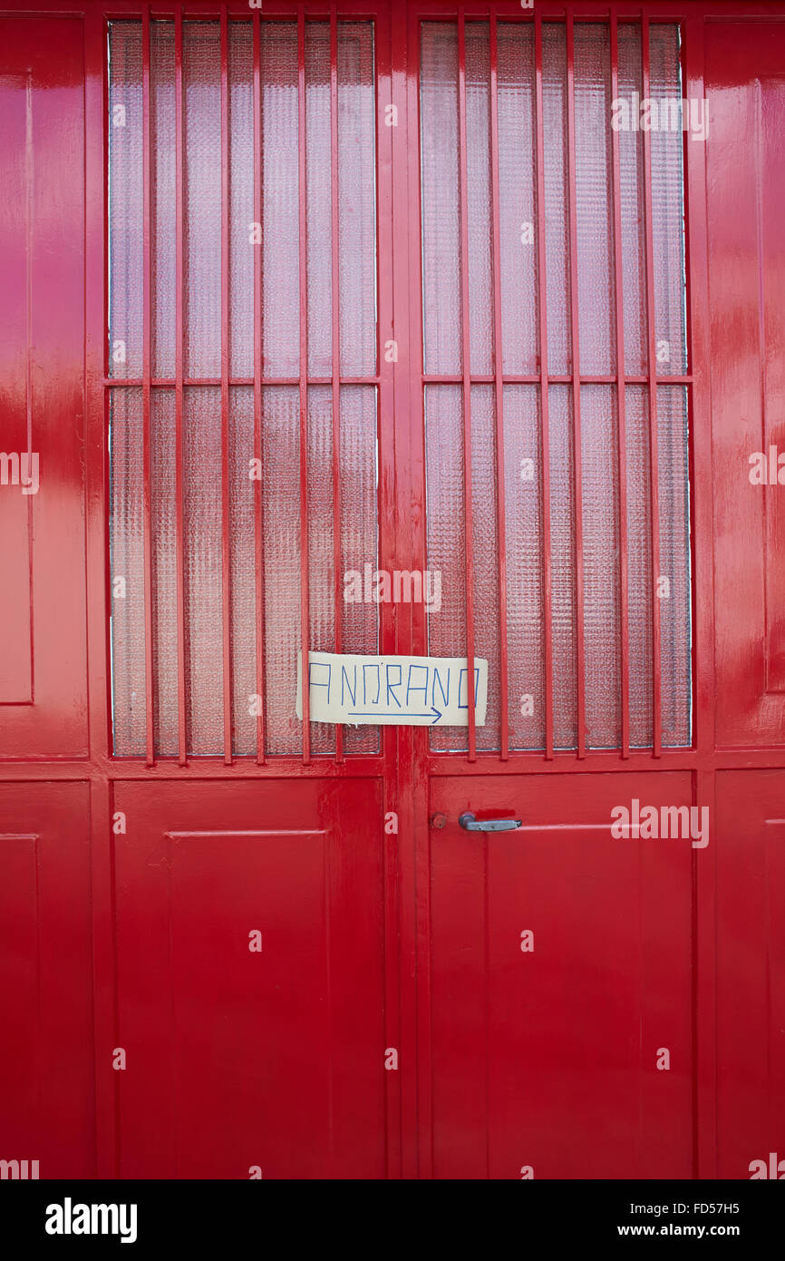 Red door and sign. Stock Photo