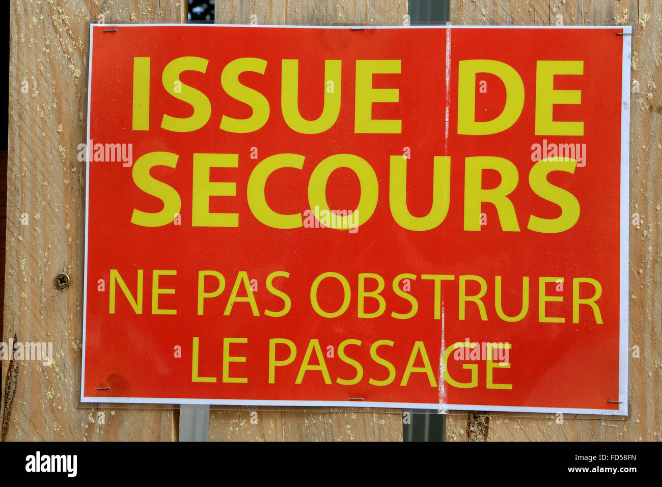 Poster: "Emergency Exit - Do not obstruct the passage." Stock Photo