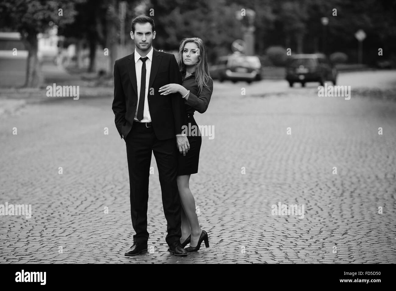 Man woman behind walking suit Black and White Stock Photos & Images - Alamy
