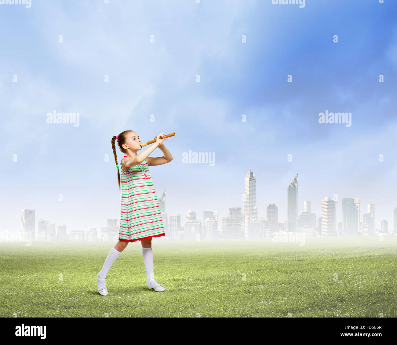 Cute little girl playing flute hires stock photography and images Alamy