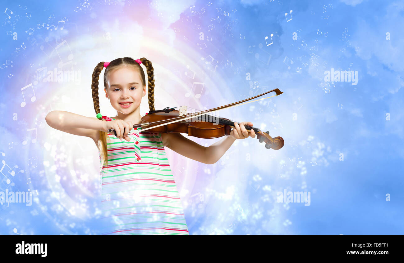 Image of cute girl playing violin against blue background Stock Photo ...