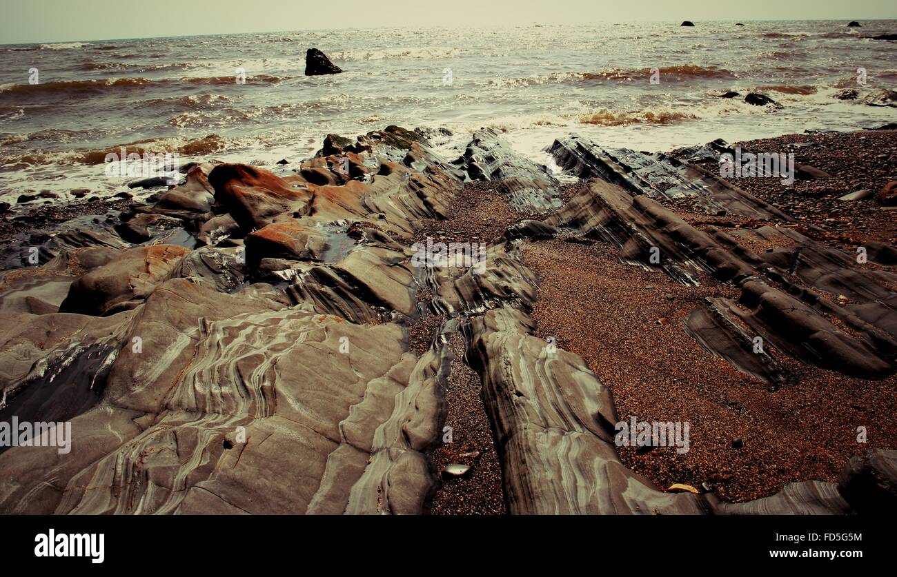 Water over rocks at beach hi-res stock photography and images - Alamy