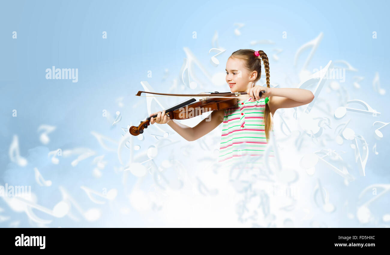 Image of cute girl playing violin against blue background Stock Photo ...