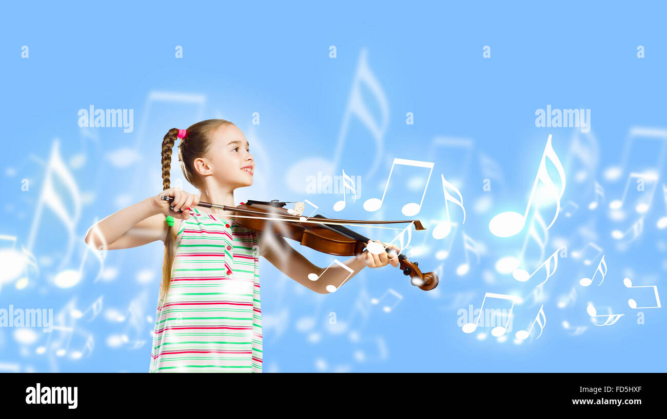 Image of cute girl playing violin against blue background Stock Photo ...