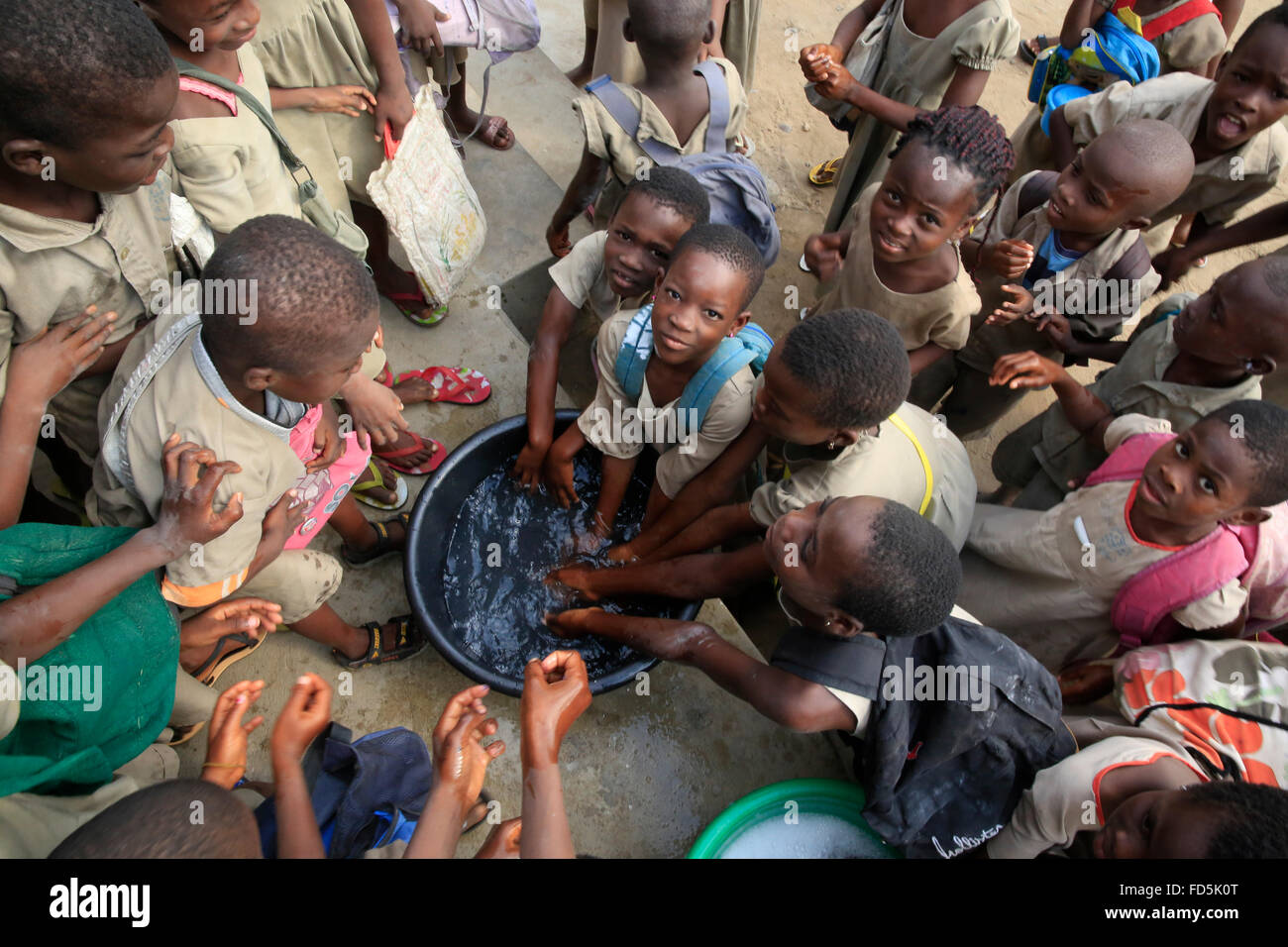African primary school. Pupils washing their hands before lunch. Stock Photo