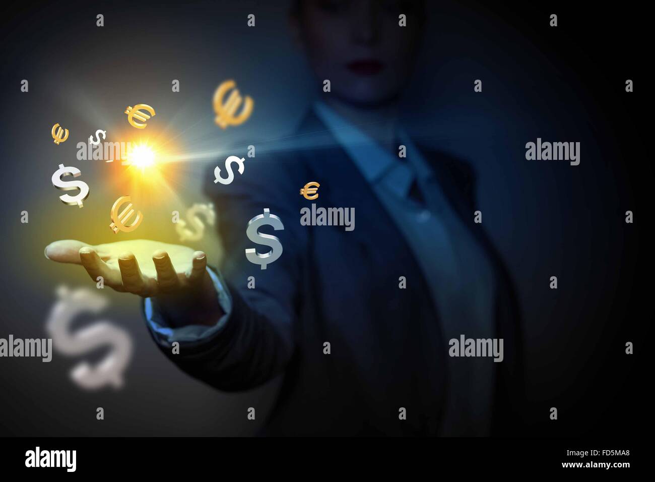 Currency symbols on human hand. Money making and wealth Stock Photo