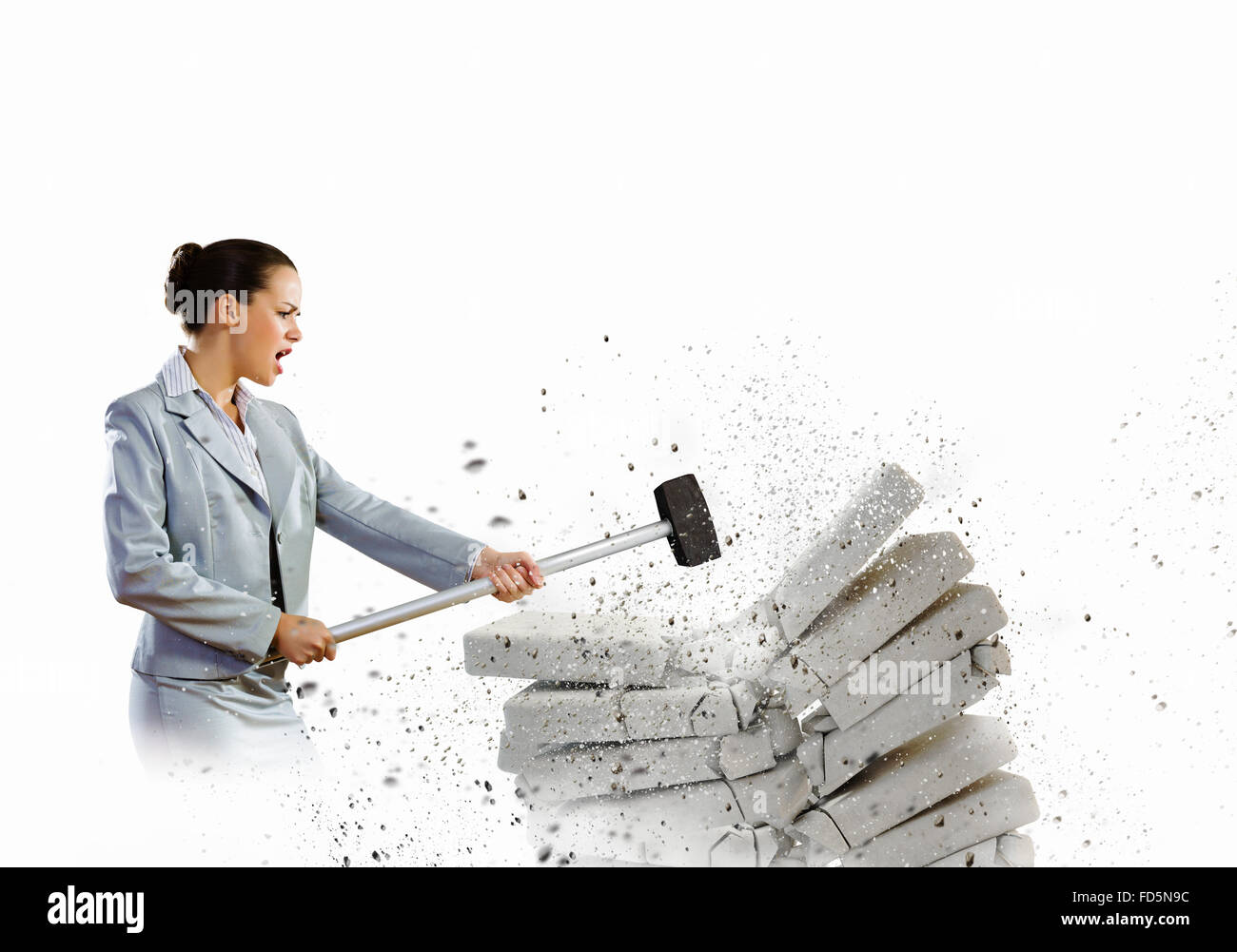 Image of businesswoman breaking bricks with hammer Stock Photo Alamy