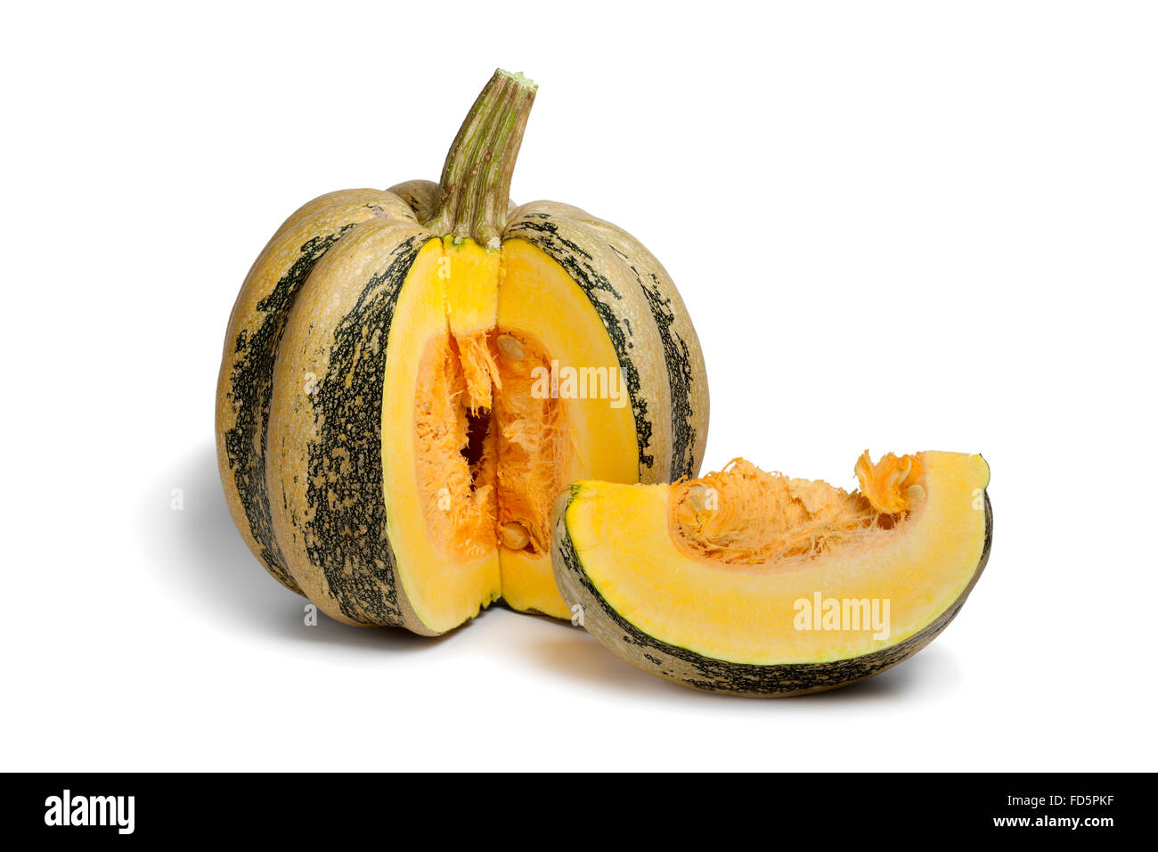 Fresh Tonda Padana pumpkin and a piece with seeds on white background Stock Photo